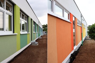 Bild vergr&ouml;&szlig;ern: Der neue Erweiterungsbau der Grundschule Dammheim mit seiner farbenfrohen, als Farbverlauf gestalteten Fassade.